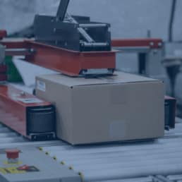 Close up of a tape machine as part of a kitting line at RIS.