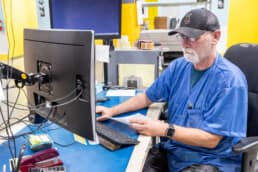 A logistics worker at RIS helps streamline fulfillment & distribution services for our OEM customers.