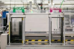 The end of an SMT line at RIS showing the auto-sorting system of good and rework boards. This automated system saves time and adds efficiency to our SMT process. It also means that workers don't need to physically touch any of the boards while transporting them to the next part of the process.