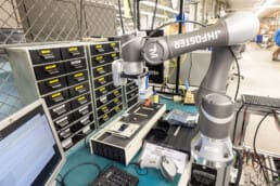 A cobot at RiverSide today being programed to do precision work.